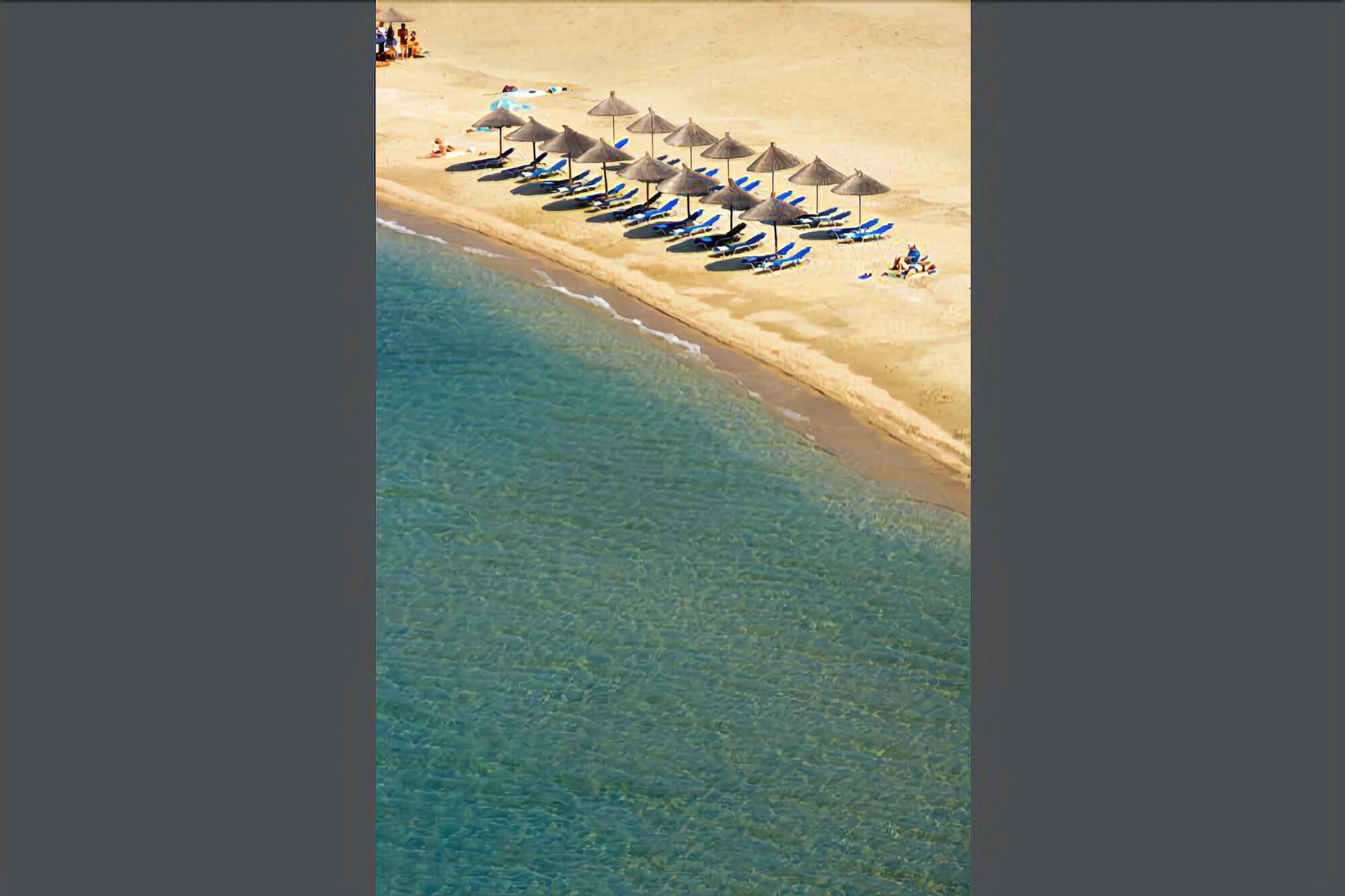 Kamari Beach Hotel Potos Bagian luar foto